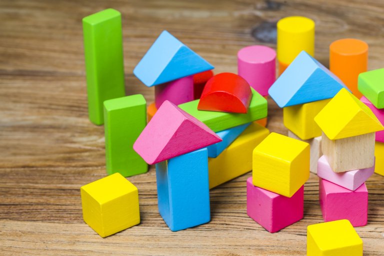 building-blocks-wooden-background-colorful-wooden-building-blocks.jpg
