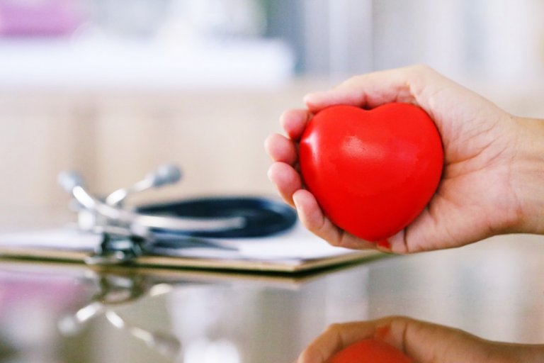 people-hand-holding-red-heart-shape-decoration-and-blur-stethoscope-with-clipboard-closeup-on-table_t20_koLPx3.jpg